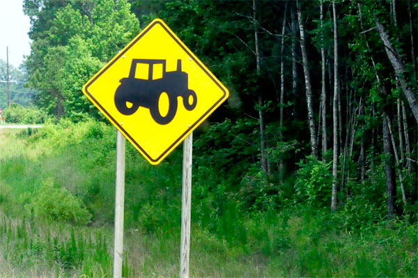 tractor on road sign